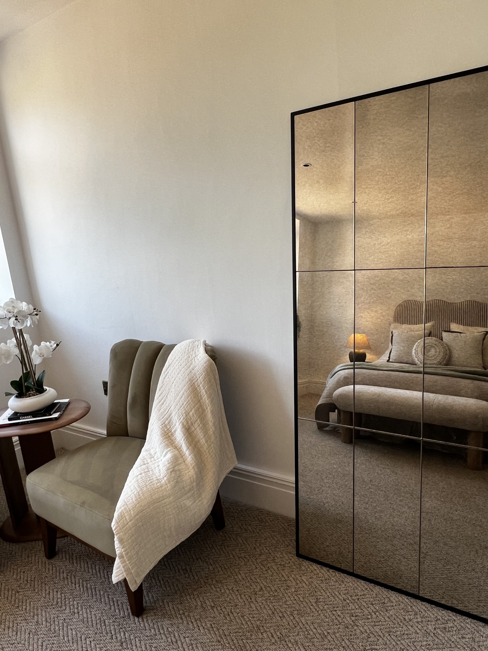 Armchair and dressing mirror in the show apartment bedroom, listed building conversion in Alton, staged by Aire Interiors
