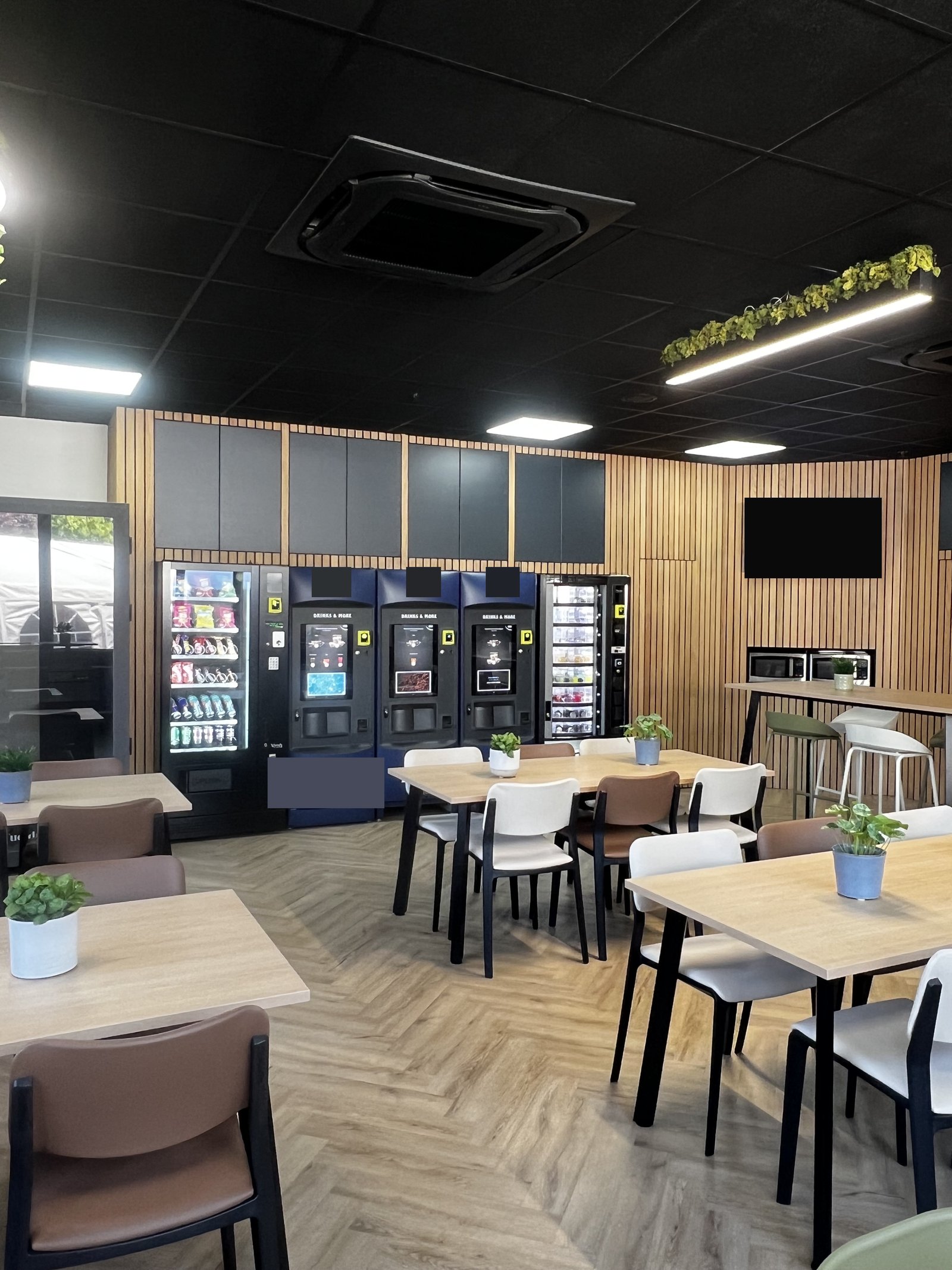 Breakout seating and vending area in the redesigned canteen, Aire Interiors