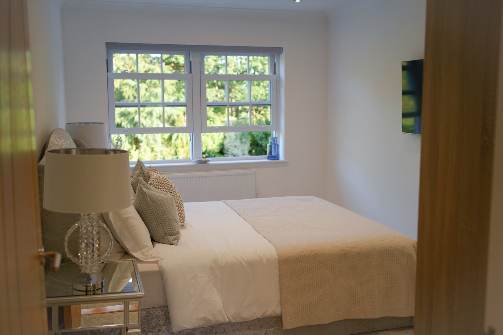 Styled bedroom with garden view, Skylark Golf and Country Club estate, Whiteley, staged by Aire Interiors