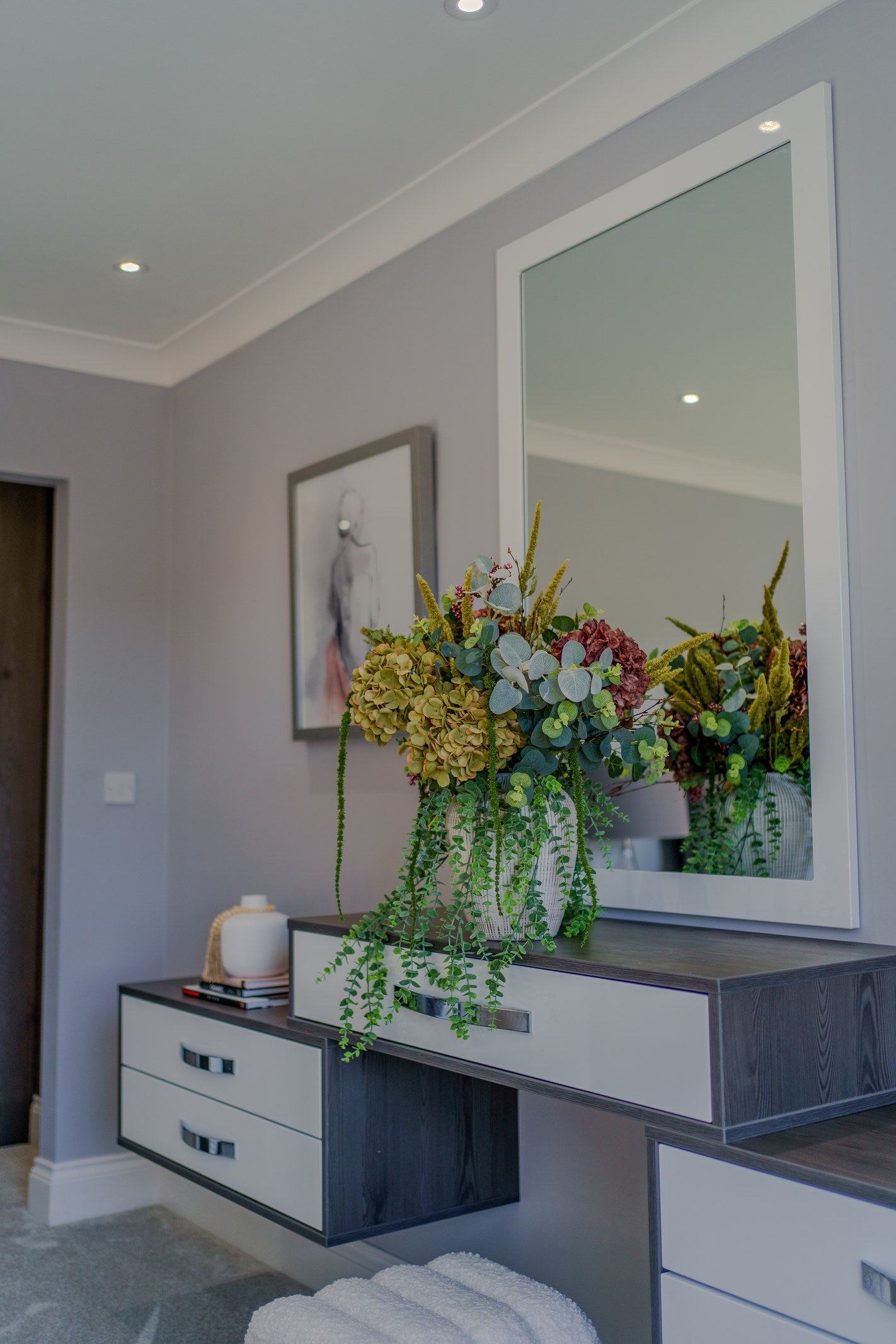 Styled entrance console and mirror, Skylark Golf and Country Club estate, Whiteley, staged by Aire Interiors