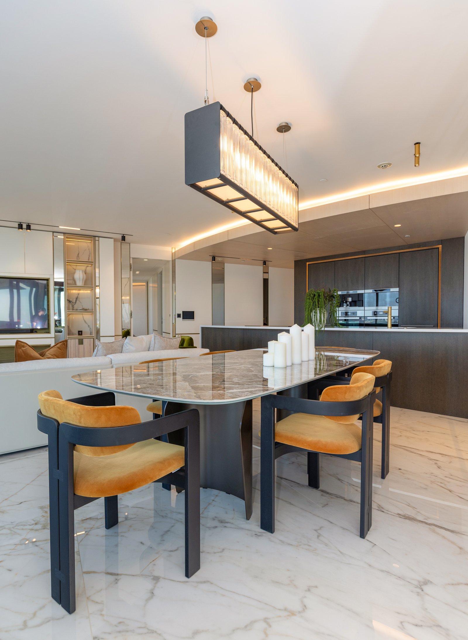 Dining area with statement pendant light and marble topped table, £4 million apartment, Vauxhall, styled by Aire Interiors