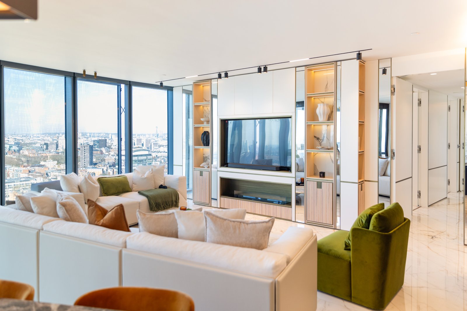 Open plan living and dining space with floor to ceiling windows over the London skyline, £4 million apartment, Vauxhall, styled by Aire Interiors